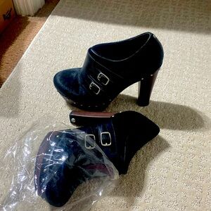 Ugg.  unique pair of UGG shoes-leather with   fur like hair you can’t find them